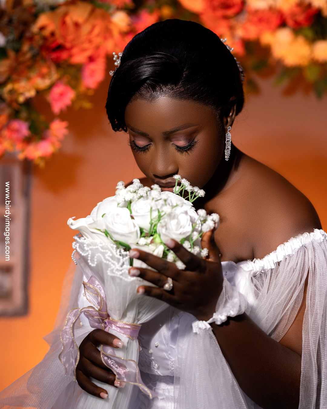 birdie7 Glamorous studio portrait of a Black woman in a sparkly red dress with a floral detail, professional photography by Birdy Images.<br />